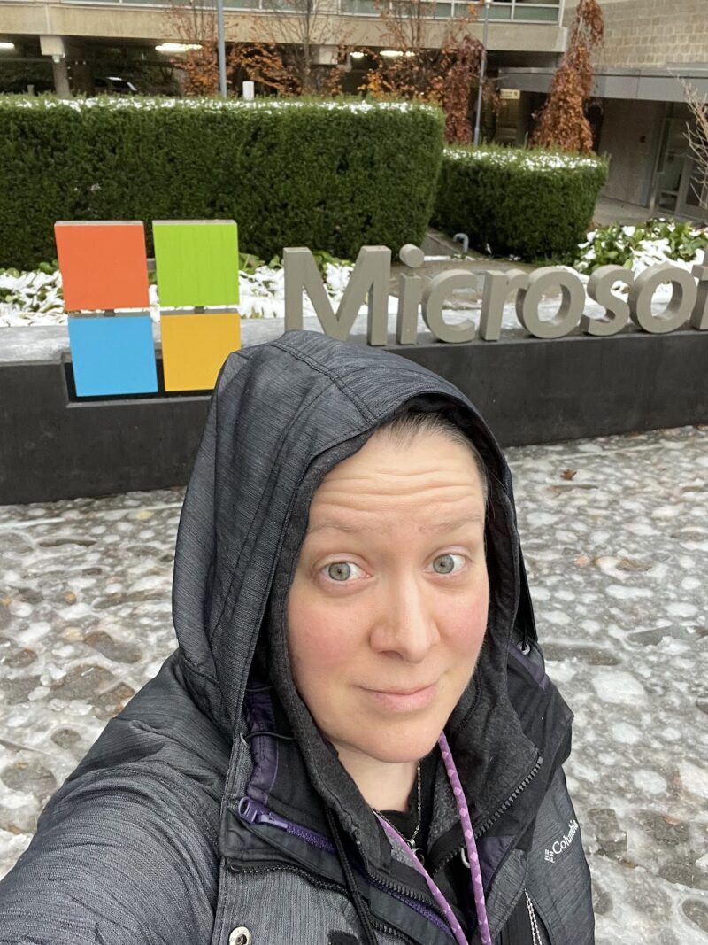 Selfie of Hilary in front of the Microsoft sign at the offices in Redmond